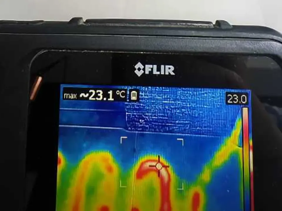 Thermal imaging camera screen showing underfloor heating pipes during leak detection survey