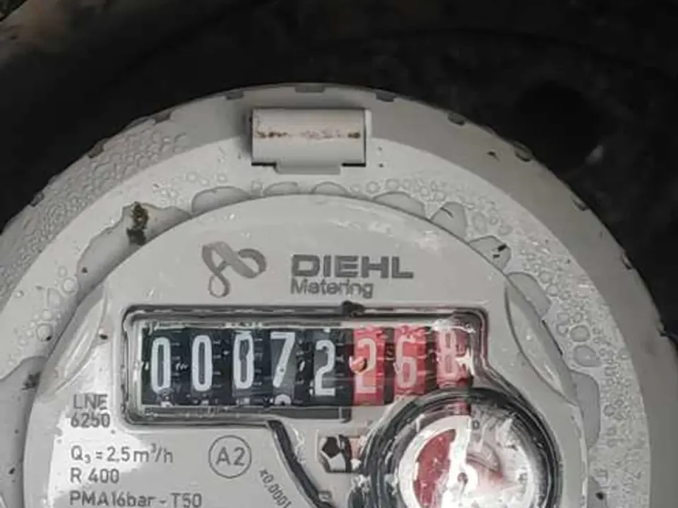 Water meter showing uncontrolled flow during leak detection investigation